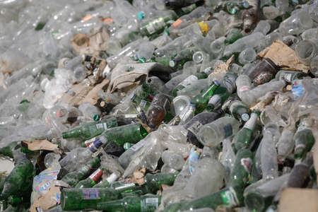 Bucharest, Romania - September 1, 2020: Empty bottles are piled up in a glass recycling facility.