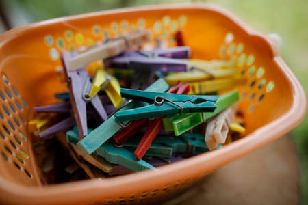Details with a stack of plastic clothes pegs