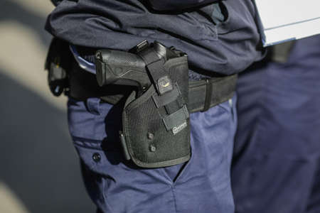 Bucharest, Romania - October 21, 2020: Details with a Beretta PX4 gun in the holster of a police...