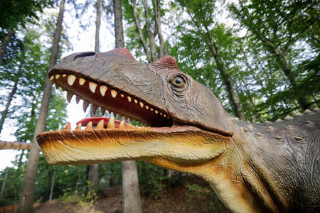 Rasnov, Romania - October 3, 2020: Details with a dinosaur model at an outdoors dino park in Romania.のeditorial素材