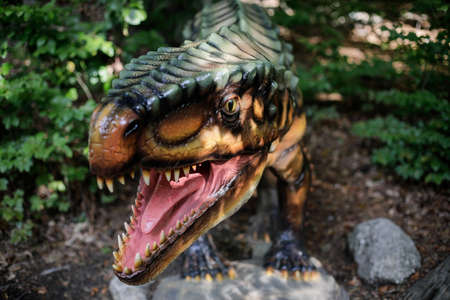 Rasnov, Romania - October 3, 2020: Details with a dinosaur model at an outdoors dino park in Romania.のeditorial素材