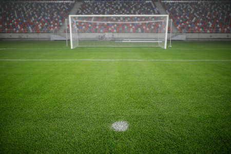 Shallow depth of field (selective focus) image with the penalty kick point on an empty soccer...