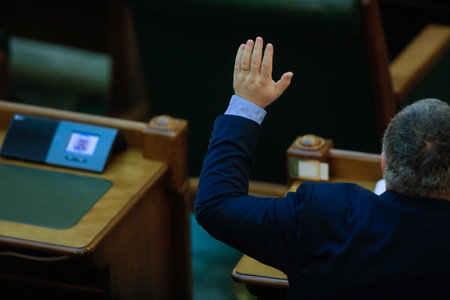 Bucharest, Romania - December 22, 2020: Romanian senators vote bills by raising their hands in a full Senate meeting.のeditorial素材