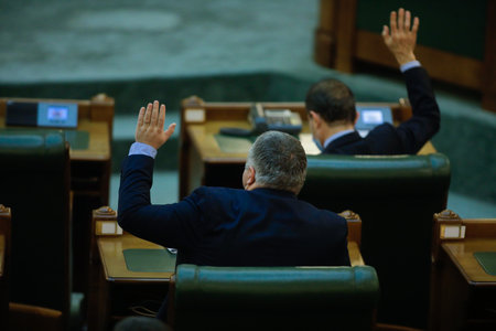 Bucharest, Romania - December 22, 2020: Romanian senators vote bills by raising their hands in a full Senate meeting.のeditorial素材
