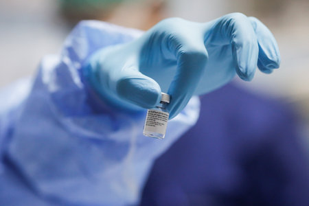 Bucharest, Romania - January 4, 2021: Shallow depth of field (selective focus) image with details of the Pfizer BioNTech vaccine in the hospital during vaccination of medical staff.のeditorial素材