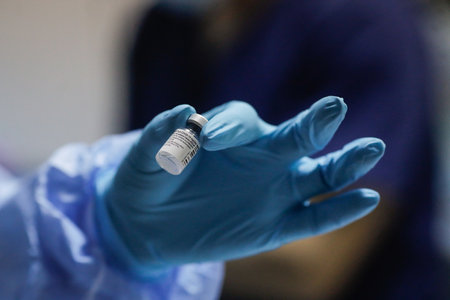 Bucharest, Romania - January 4, 2021: Shallow depth of field (selective focus) image with details of the Pfizer BioNTech vaccine in the hospital during vaccination of medical staff.のeditorial素材