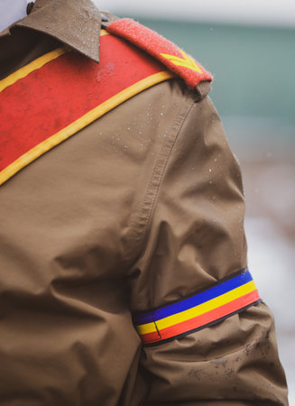 Shallow depth of field (selective focus) with the uniform of a Romanian soldier during an official ceremony on a cold and snowy winter day.の写真素材
