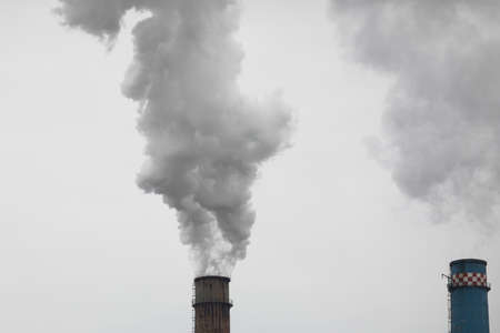 Chimney of a power station during a cold winter day in Bucharest.の写真素材