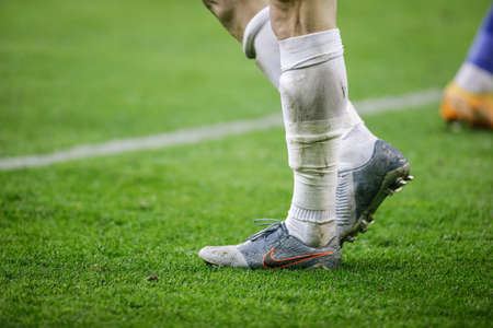 Bucharest, Romania - March 19, 2021: Details with Nike soccer shoes on a player during a game.のeditorial素材