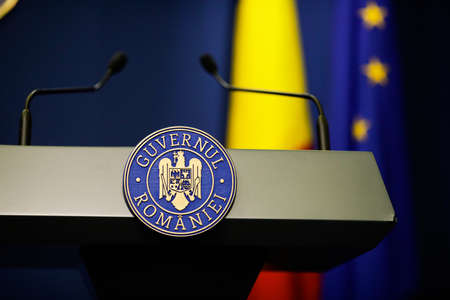 Bucharest, Romania - April 17, 2021: Details with the Romanian Government logo during a press conference held by a politician.のeditorial素材