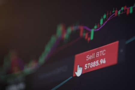 Shallow depth of field footage with details of Bitcoin cryptocurrency price fluctuations on a crypto...