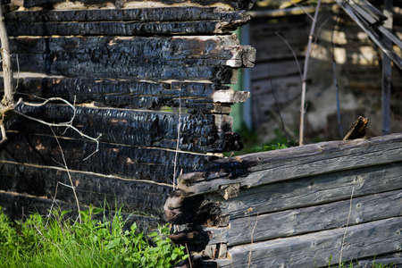 Shallow depth of field (selective focus) details with burned wood from a burnt house.の写真素材