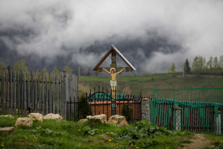 Pestera, Romania - May 14, 2021: Christian orthodox shrine (cross) with Jesus Christ as a funeral...