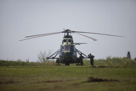 Smardan, Romania - May 11, 2021: Romanian army helicopter at the Smardan military shooting range (IAR 330, Puma Naval).のeditorial素材
