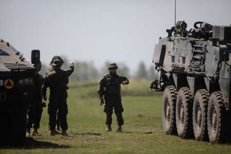 Smardan, Romania - May 11, 2021: Polish soldiers take part in a joint military exercise in Smardan firing range, southeastern Romania.のeditorial素材