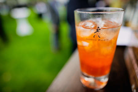 Bucharest, Romania - June 17, 2021: Shallow depth of field (selective focus) details with a Johnnie Walker labeled glass on a bar counter.のeditorial素材