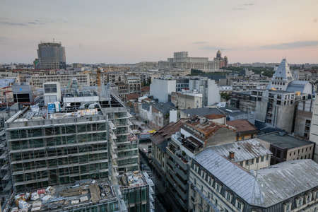 Bucharest, Romania - August 13, 2021: Overview of the old part of Bucharest during a summer sunset. New and old buildings together.のeditorial素材