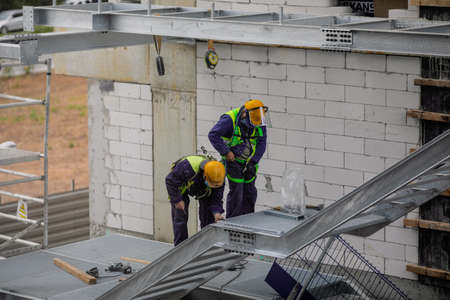 Bucharest, Romania - September 23, 2021: Construction workers on a construction site in Bucharest.のeditorial素材