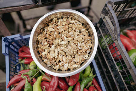 Shallow depth of field (selective focus) image with walnuts sold by a Romanian man from his garden...