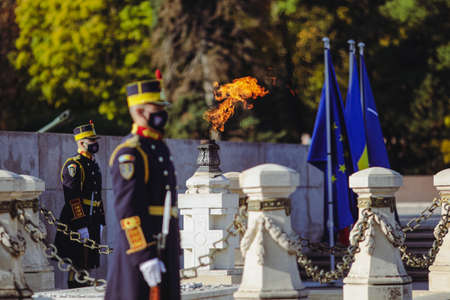 Bucharest, Romania - October 25, 2021: Soldiers guard the eternal flame for the army heroes during a...
