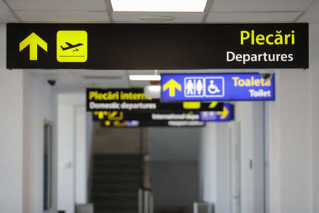 Bucharest, Romania - 11 November, 2021: Shallow depth of field (selective focus) image with the Departures sign inside the Aurel Vlaicu (Baneasa) airport.のeditorial素材