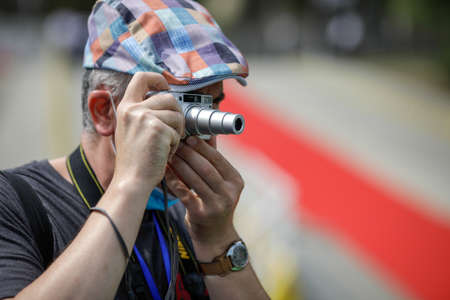 Braila, Romania - August 26, 2021:Shallow depth of field (selective focus) details with a man taking...