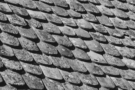 Shallow depth of field (selective focus) details of Transylvanian saxon traditional clay tiles.の写真素材