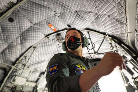 Bucharest, Romania - July 2, 2021:  A crew member of an Alenia C27J Spartan military cargo plane...