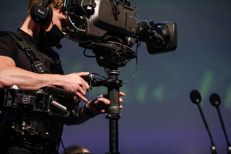 Bucharest, Romania - January 15, 2022: Professional steadicam (gimbal) operator filming a classical...