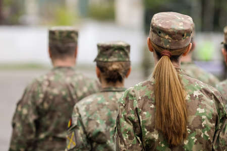 Bucharest, Romania - April 28, 2022: Romanian female land forces soldier take part at a public ceremony.のeditorial素材