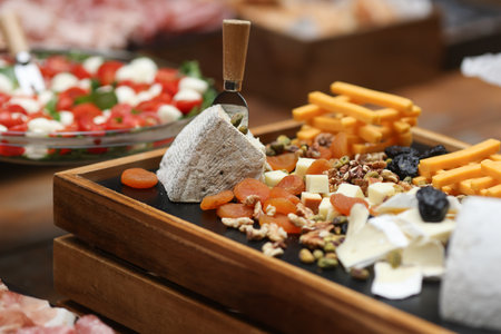 Shallow depth of field (selective focus) details with various types of cheese at a buffet.の写真素材