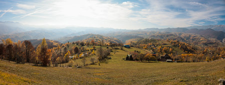 Panoramic overview of Magura village in Romania, near the Piatra Craiului mountains.の写真素材