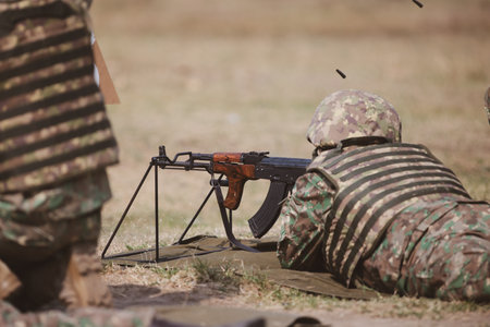 Romanian reservists take part at a drill where they train to shoot weapons.