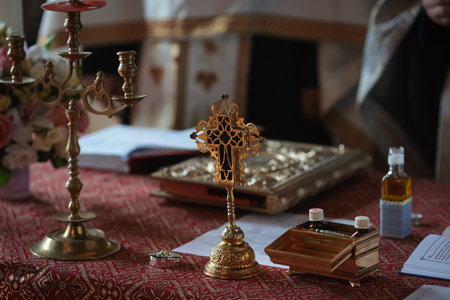Shallow depth of field (selective focus) details with accessories of an orthodox priest in church during a baptism.の写真素材