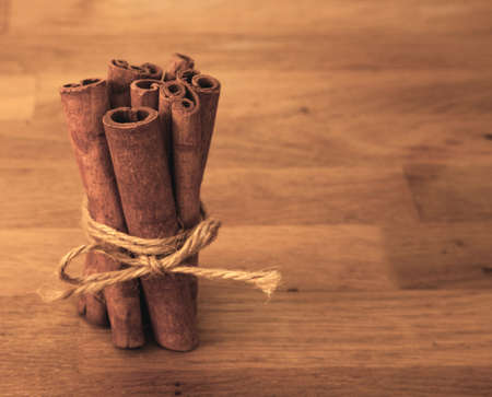 fresh cinnamon on wooden tableの写真素材