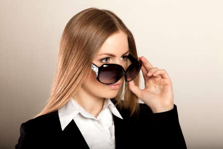 Young beautiful blonde woman with sunglassesの写真素材