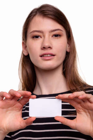 Cute Beautiful Woman Showing Blank Business Card Stock Imageの写真素材