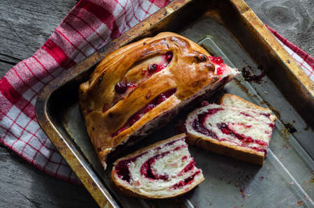 Homemade pie on grey wooden background with napkinの写真素材