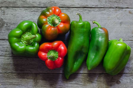 Fresh red pepper on wooden background, selective focusの写真素材