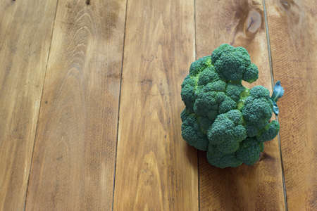 Fresh green broccoli on the wooden tableの写真素材
