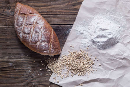 Healthy bread on wooden background. Natural light.の写真素材