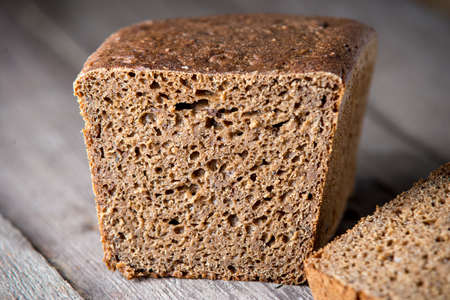 Healthy bread on old wooden background