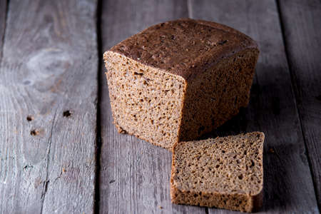 Healthy bread on old wooden background