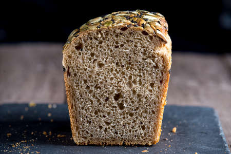 Healthy bread on old wooden background
