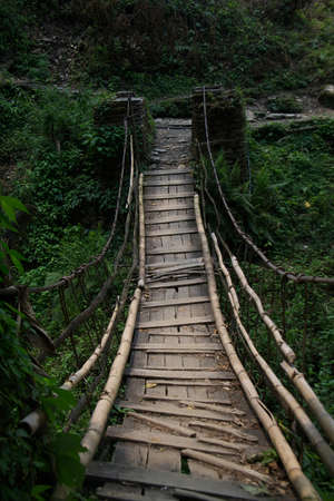 Wooden bridge on the trail between Gandruk and Landruk in Nepalの写真素材
