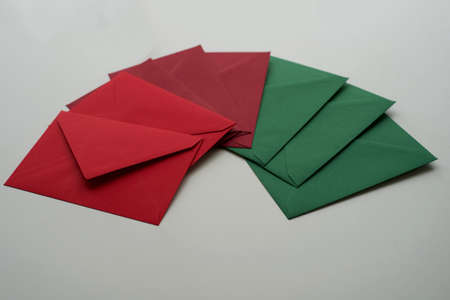 Christmas Color Palette envelopes. Red, garnet and green mails placed in a semicircle