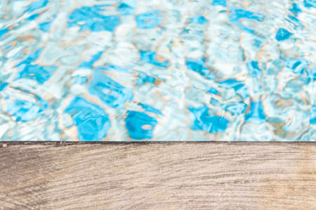 The edge of a swimming pool in summerの写真素材