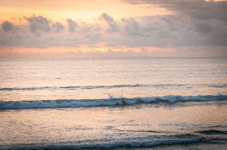 Sunset and clouds on a tropical beachの写真素材