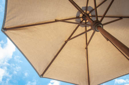 Summertime sunbathing under an umbrellaの写真素材