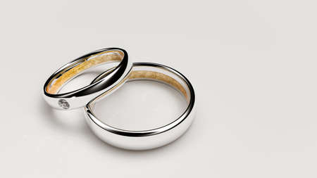 Pair of lovers wedding rings with a small diamond